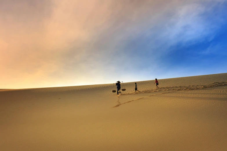 a couple of people that are walking in the sand, skies, humans exploring, instagram post, australian