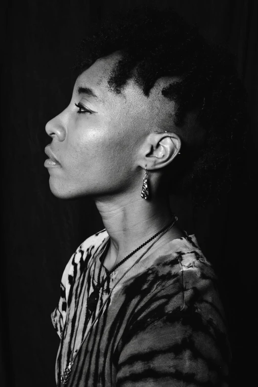 a black and white photo of a woman, inspired by Makoto Aida, trending on pexels, hyperrealism, shaved sides, willow smith young, childish gambino, androgynous male