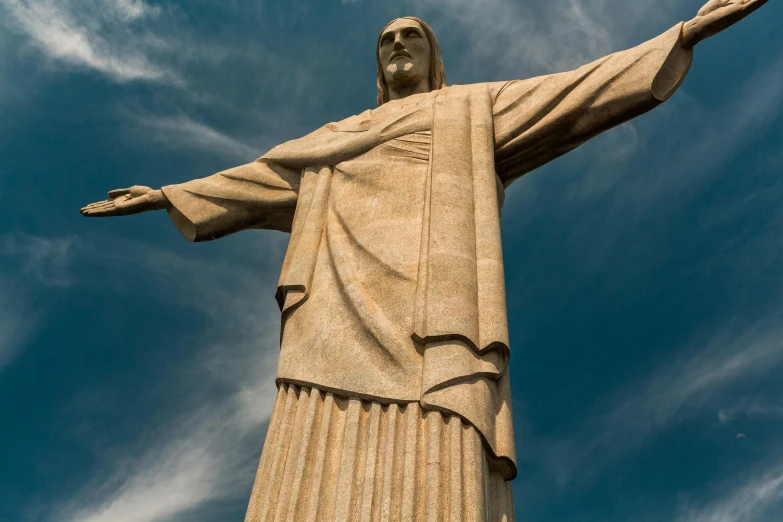 a statue of jesus stands in front of a blue sky, pexels contest winner, graffiti, president of brazil, avatar image, john pawson, monumental structures