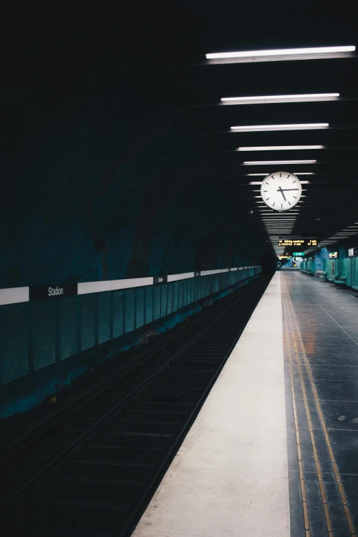 a train station with a clock on the wall, unsplash contest winner, postminimalism, square, dark underground, teal aesthetic, wide long view