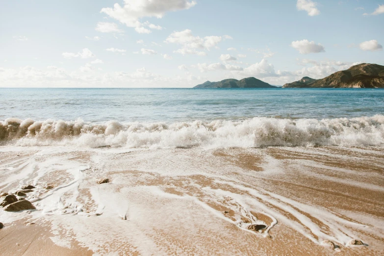 a man riding a surfboard on top of a sandy beach, by Carey Morris, pexels contest winner, renaissance, great barrier reef, 2 5 6 x 2 5 6 pixels, a photo of a lake on a sunny day, ((waves