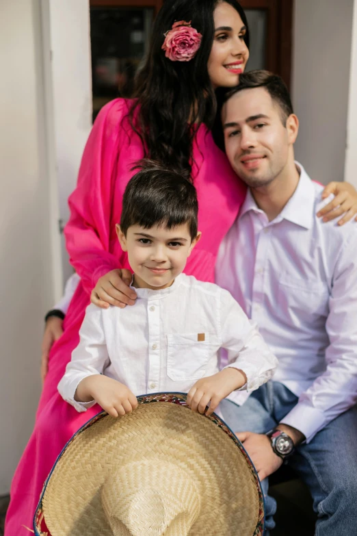 a man sitting next to a woman and a boy, a picture, by Maryam Hashemi, pexels contest winner, congas, wearing a kurta, 15081959 21121991 01012000 4k, headshot profile picture