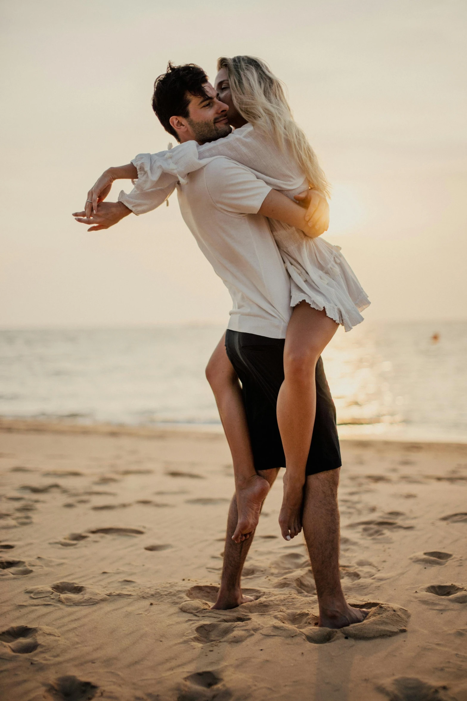 a man carrying a woman on the beach, pexels contest winner, renaissance, dancing elegantly over you, soft shade, vine, tan