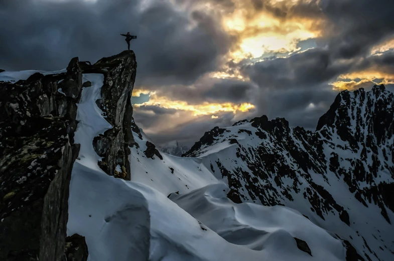 a person standing on top of a snow covered mountain, by Peter Churcher, pexels contest winner, baroque, craggy, last light, avatar image