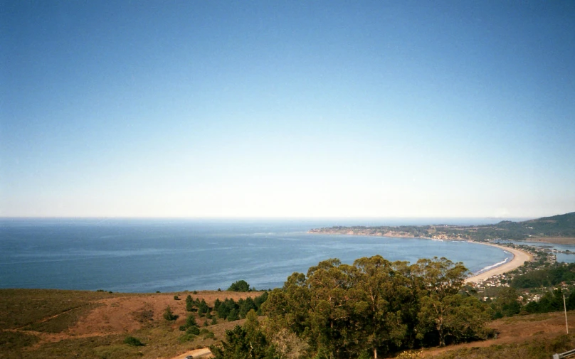 a view of the ocean from the top of a hill, ektachrome color photograph, clear blue skies, bay area, 2000s photo