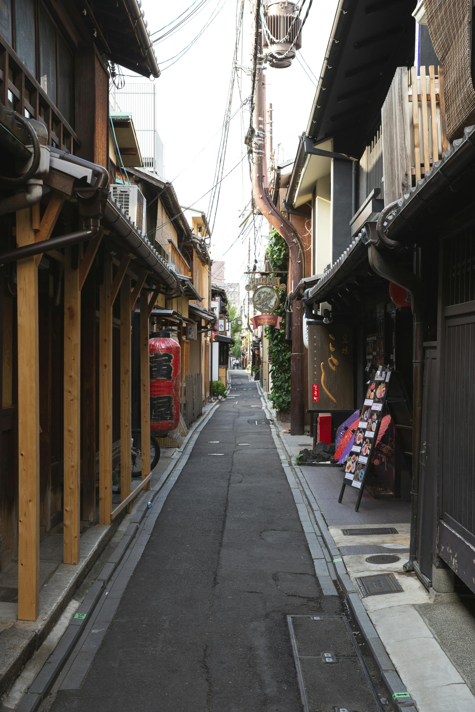 a narrow street lined with wooden buildings, a picture, unsplash, ukiyo-e, exterior photo, color image, buttresses, overview