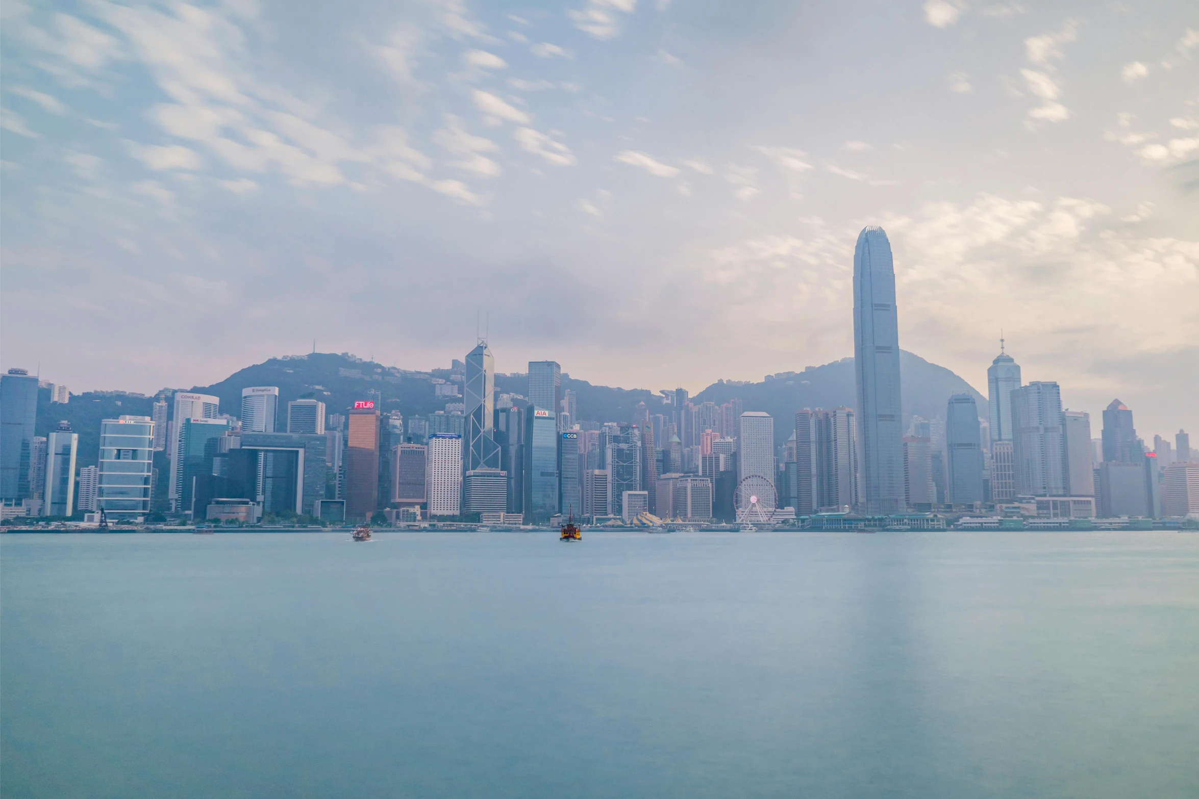 a large body of water with a city in the background, pexels contest winner, hong kong buildings, early in the morning, banner, foster and partners