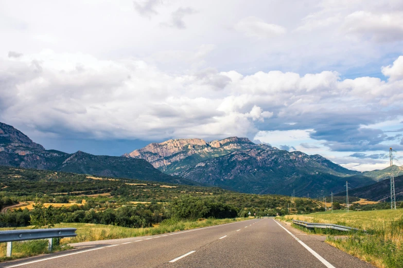 an empty road with mountains in the background, by Juan Giménez, unsplash, les nabis, monserrat gudiol, panels, high quality product image”