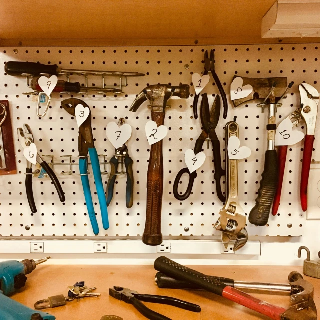 a bunch of tools are hanging on a pegboard, pexels contest winner, missing panels, caretaker, reddit post, indoor