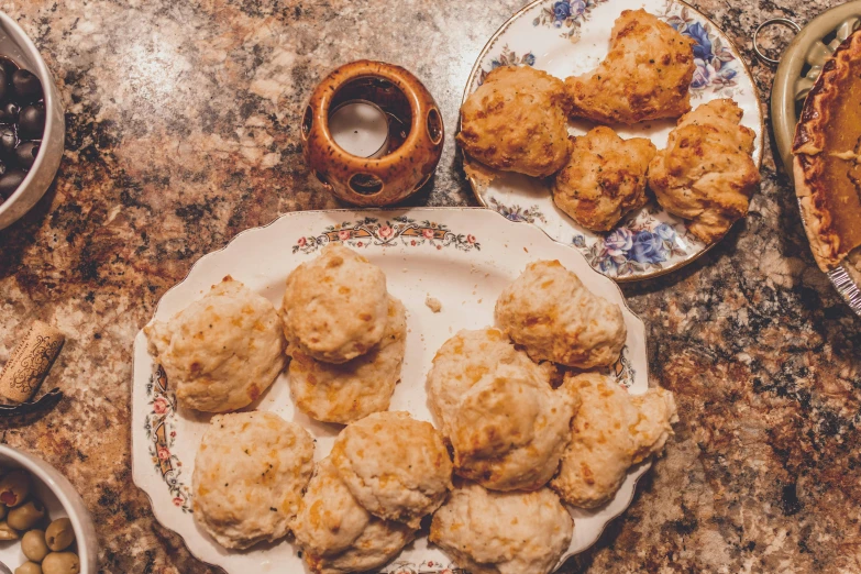 a close up of a plate of food on a table, by Carey Morris, unsplash, dau-al-set, baking cookies, puffy, louisiana, background image