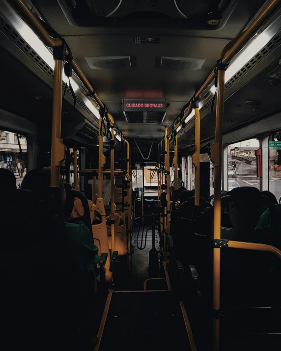 a bus filled with lots of people sitting next to each other, by Carey Morris, pexels contest winner, dimly lit interior room, 🚿🗝📝, yellow and black trim, thumbnail
