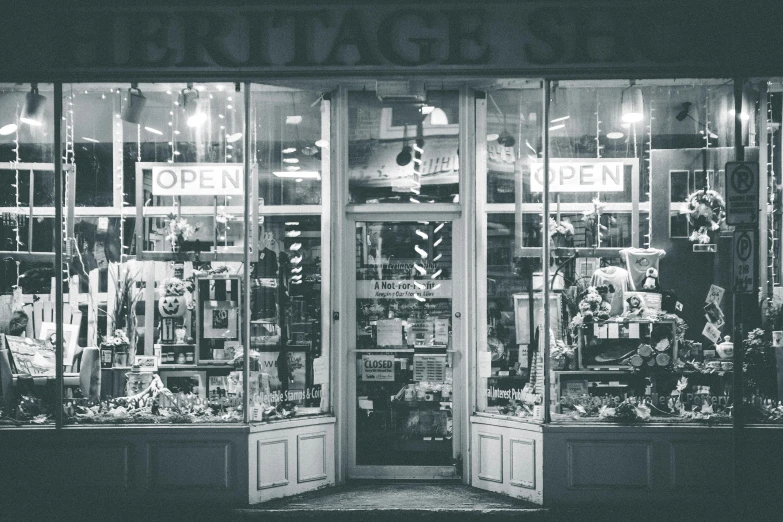 a black and white photo of a store front, pexels contest winner, assemblage, english heritage, in the evening, color vintage, hardware