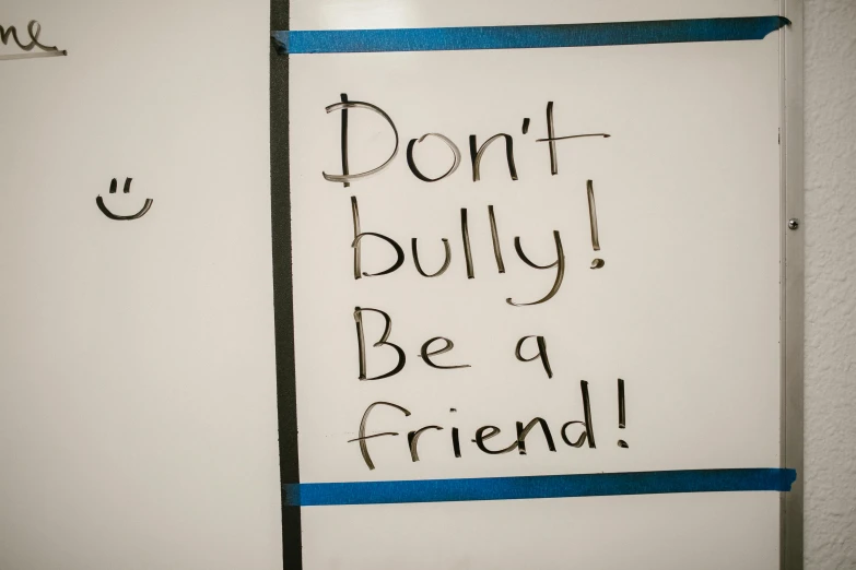a refrigerator with the words don't bully be a friend written on it, a poster, pexels, whiteboards, 2 0 5 6, blue, robb cobb