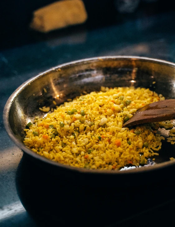 a frying pan filled with rice and vegetables, by Jessie Algie, trending on unsplash, hurufiyya, gold flaked flowers, thumbnail, calcutta, pastelle