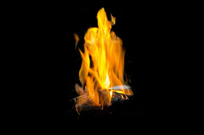 a close up of a fire in the dark, an album cover, by Jan Rustem, pexels, visual art, campfire, on black background, miniature product photo, fire!! full body