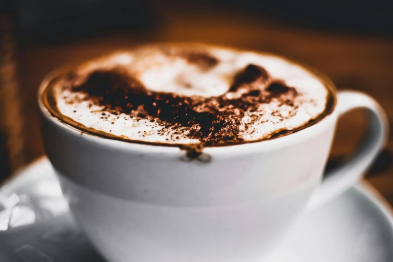 a close up of a cup of coffee on a saucer, pexels contest winner, hot cocoa drink, background image, profile shot, thumbnail