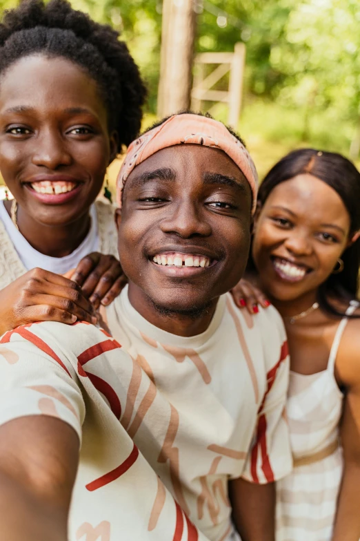 a group of people taking a selfie together, by Chinwe Chukwuogo-Roy, trending on pexels, portrait of a smiling, african man, avatar image, official screenshot