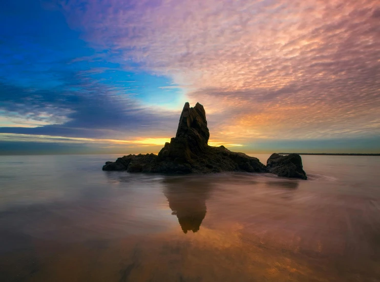 a rock in the middle of a body of water, by Andries Stock, unsplash contest winner, romanticism, colourful sky, australian beach, strange formations, today\'s featured photograph 4k