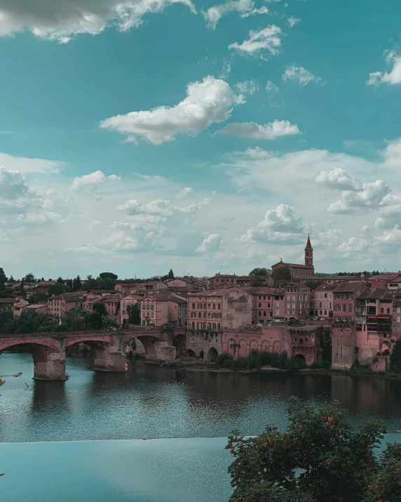 a large body of water with a bridge over it, a polaroid photo, pexels contest winner, post-impressionism, large windows to french town, naboo, shades of pink and blue, cloicsonne