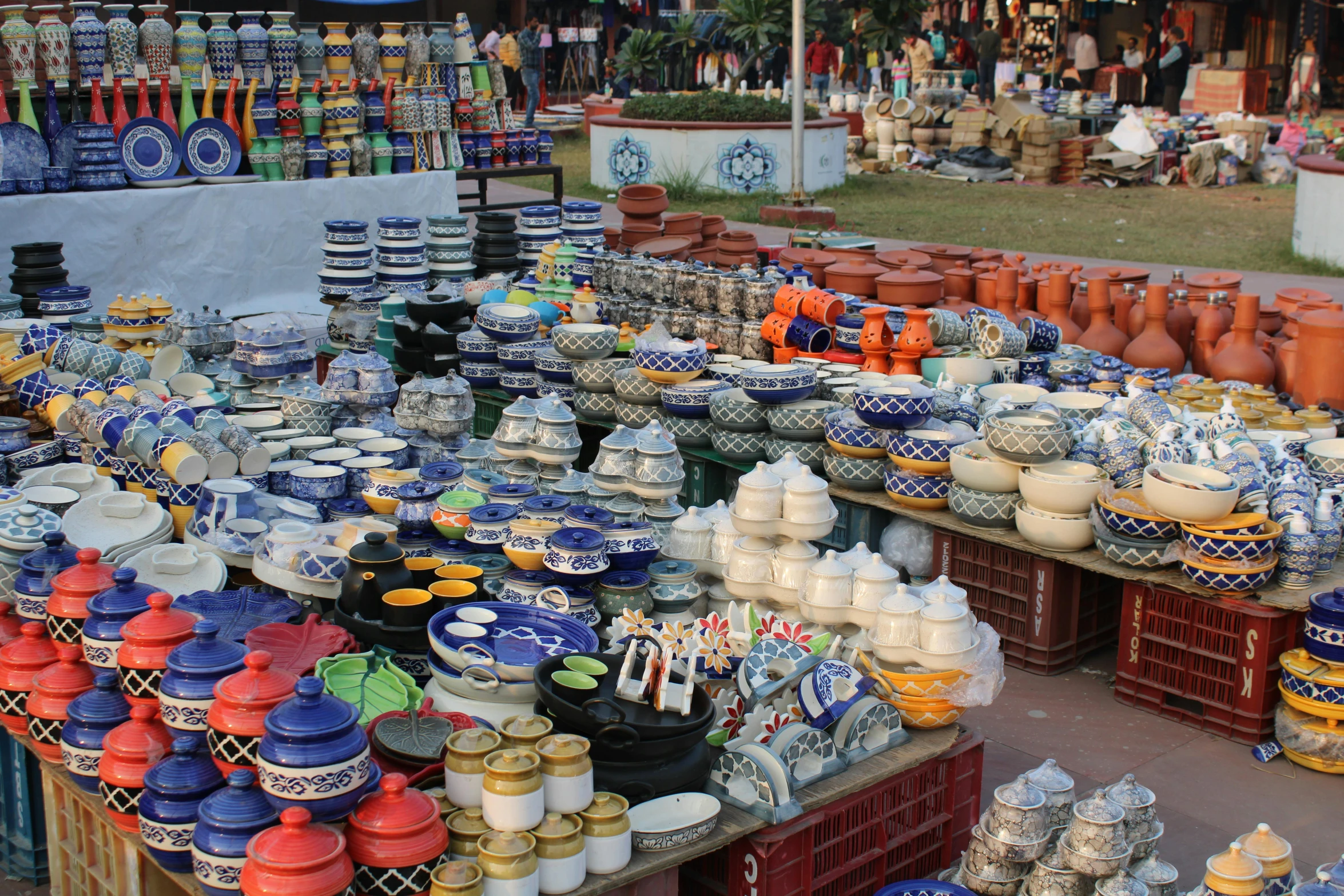 a market filled with lots of different types of pottery, avatar image