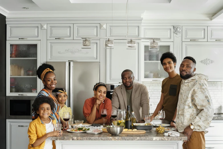 a group of people standing around a kitchen island, pexels contest winner, renaissance, african canadian, happy family, avatar image, medium shot portrait