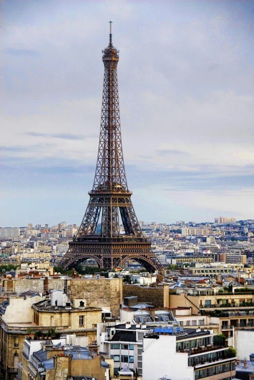 the eiffel tower towering over the city of paris, slide show, fan favorite, photograph, sprawling