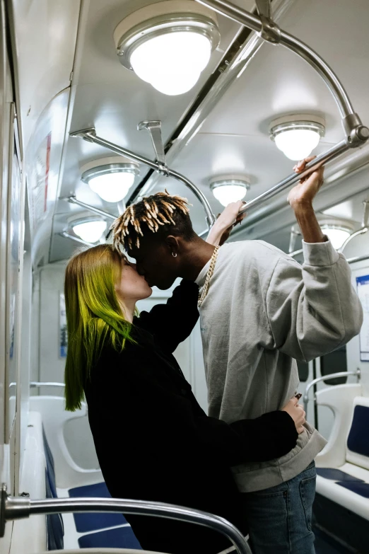 a man and a woman kissing on a train, trending on unsplash, playboi carti and lil uzi vert, green mane, moscow metro, hyperrealistic ”