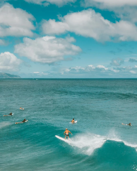 a group of people riding surfboards on top of a wave, lush paradise, thumbnail, 2019 trending photo