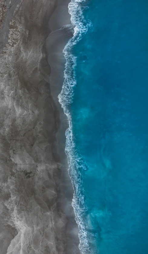 a large body of water next to a sandy beach, by Jacob Toorenvliet, unsplash contest winner, minimalism, bird\'s eye view, 15081959 21121991 01012000 4k, blue glacier, two colors