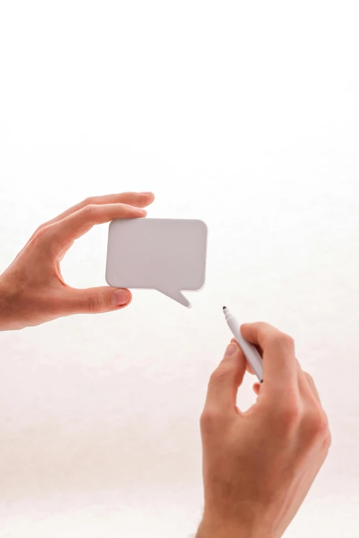 a person holding a piece of paper in one hand and a pen in the other, by Julian Allen, unsplash, conceptual art, speech bubbles, square, without text, 15081959 21121991 01012000 4k