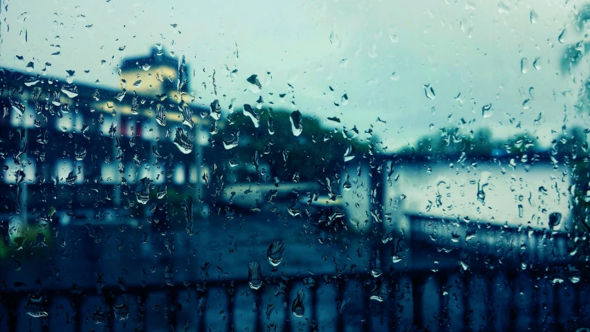 a view of a city through a rainy window, pexels contest winner, hurufiyya, depressing and hopeless vibe, tear drops, blue mood, facebook post