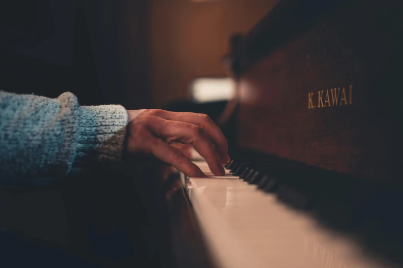 a close up of a person playing a piano, by Matija Jama, trending on pexels, vintage color, 15081959 21121991 01012000 4k, a cozy, kai carpenter