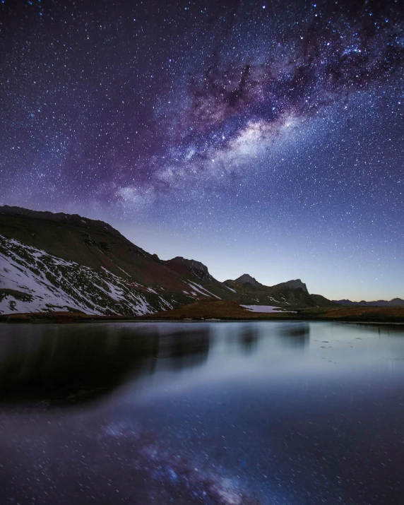 the milky shines brightly above a mountain lake, by Niklaus Manuel, purplish space in background, 5 0 0 px, high-quality photo