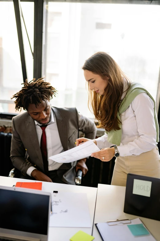 a group of people sitting around a table with laptops, a cartoon, pexels contest winner, renaissance, woman in business suit, two people, standing on a desk, morning golden hour