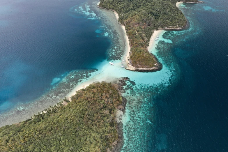 an aerial view of an island in the middle of the ocean, by Daren Bader, pexels contest winner, sumatraism, white beaches, thumbnail, two medium sized islands, eagle coral