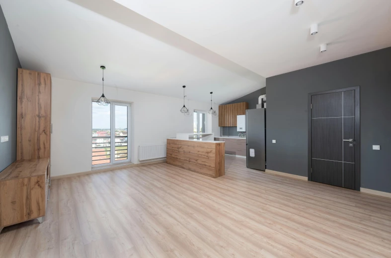 a living room filled with furniture and a flat screen tv, by Adam Marczyński, unsplash, light and space, big open floor 8 k, panorama view, minimal kitchen, taken with canon 5d mk4