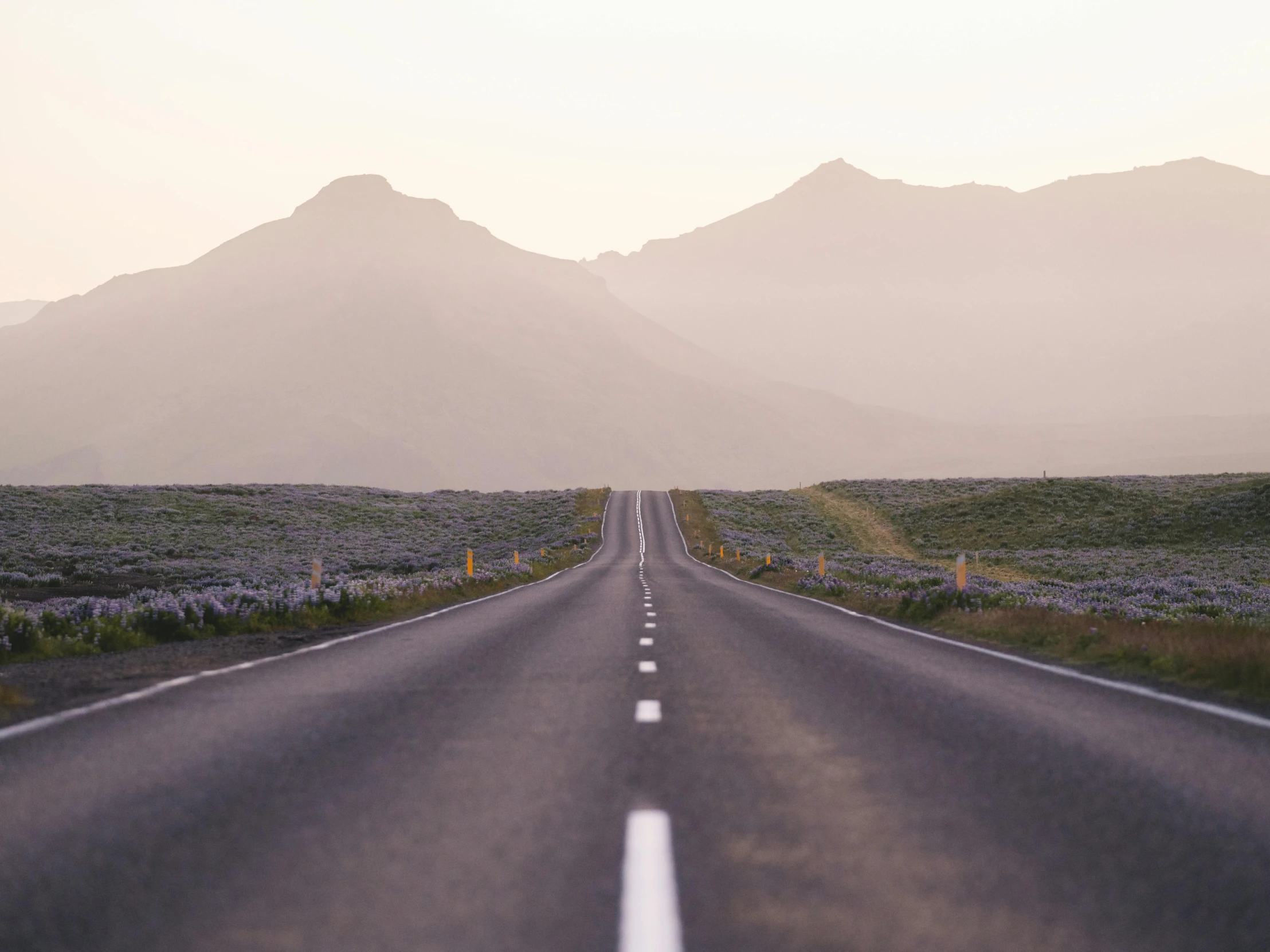 an empty road with mountains in the background, by Hallsteinn Sigurðsson, pexels contest winner, postminimalism, summer evening, 🚿🗝📝