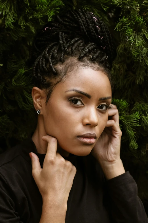 a woman holding a cell phone to her ear, inspired by Ceferí Olivé, trending on pexels, renaissance, mixed race woman, dramatic serious pose, black tendrils, lush surroundings