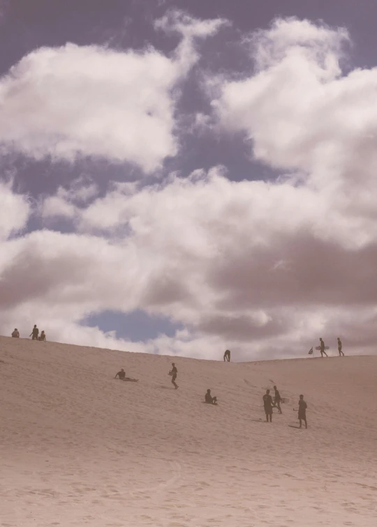 a group of people standing on top of a sandy hill, trending on unsplash, surrealism, volumetric clouds, today\'s featured photograph 4k, summer day, kodak hie infrared film