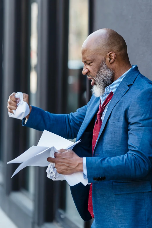 a man in a blue suit holding a piece of paper, pexels contest winner, renaissance, high winds, sweating profusely, steve harvey as the flash, older male