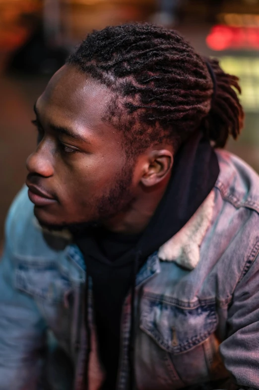 a man with dreadlocks sitting on a curb, trending on pexels, visual art, headshot profile picture, ( ( dark skin ) ), sideburns, faded glow