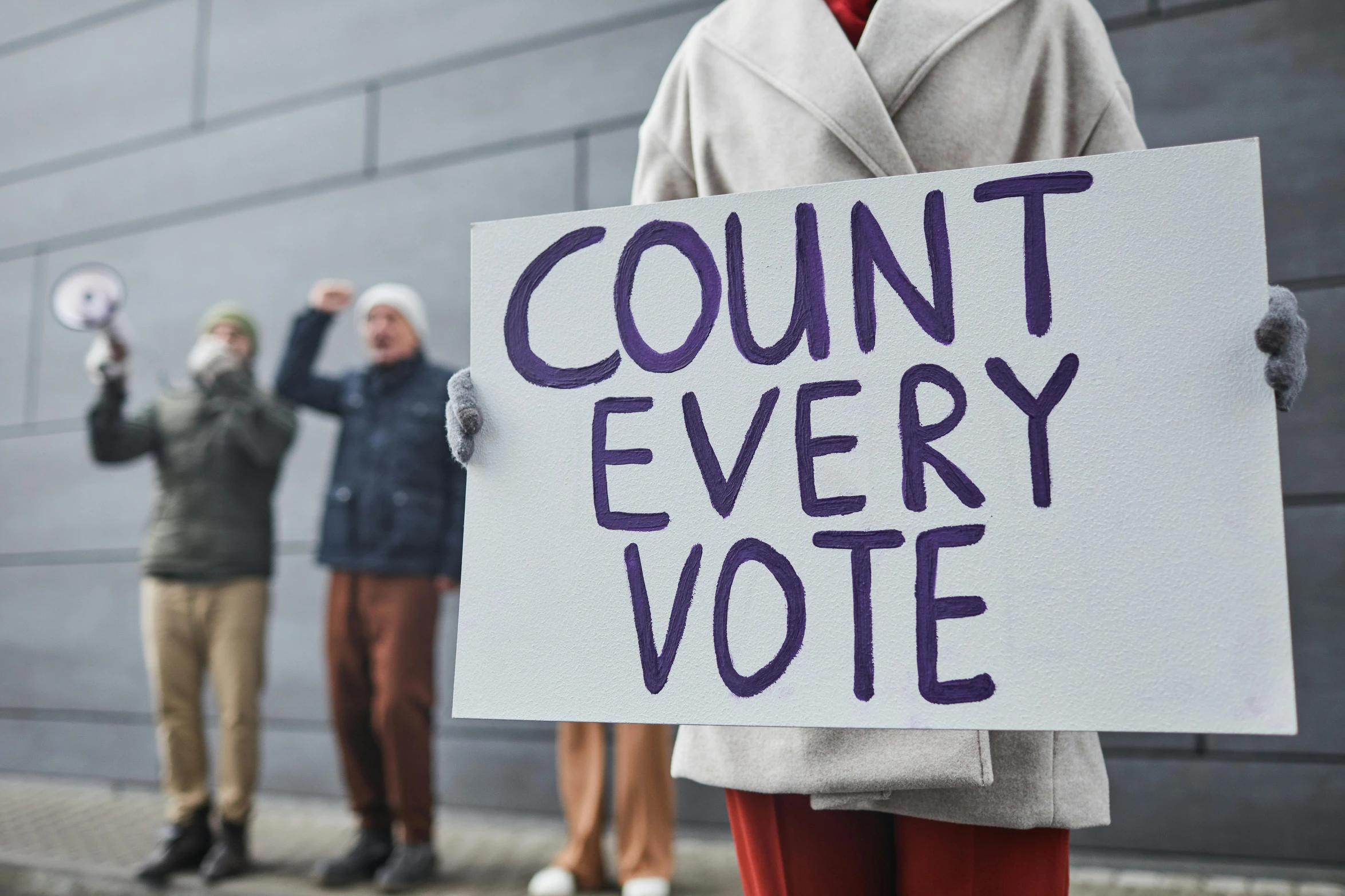 a person holding a sign that says count every vote, a photo, shutterstock, instagram post, a group of people, best photo, protest