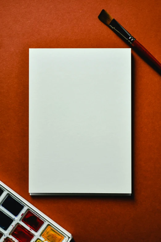 a piece of paper sitting on top of a table, by James Morris, pexels, private press, white panels, paperback, foam, rectangle