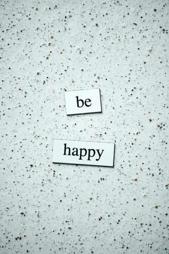 a piece of paper with the words be happy on it, pexels, magnetic, made of all white ceramic tiles, paul barson, wall art