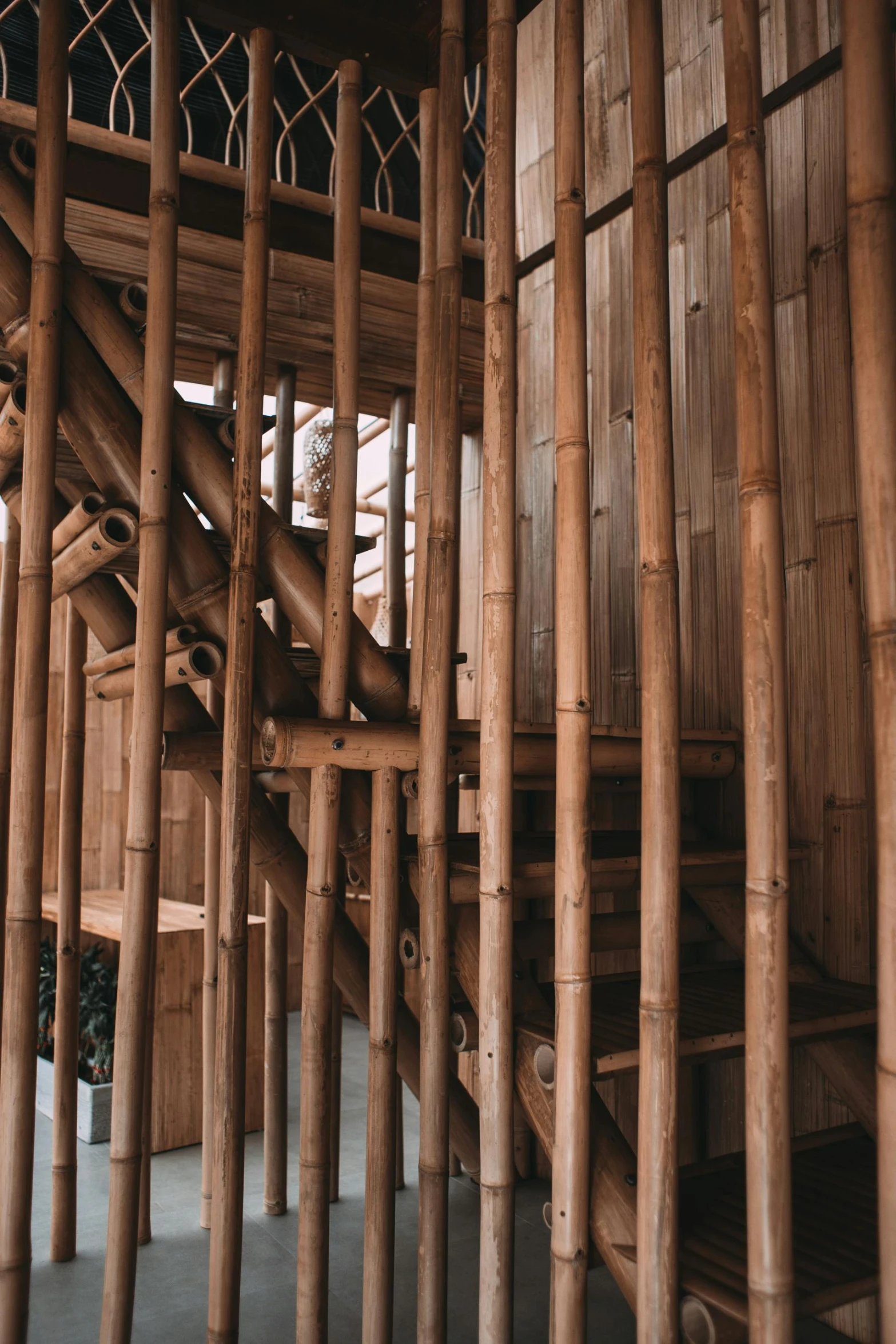 a close up of a wooden staircase in a building, by Jan Tengnagel, trending on unsplash, bamboo huts, vietnam, alessio albi, exterior