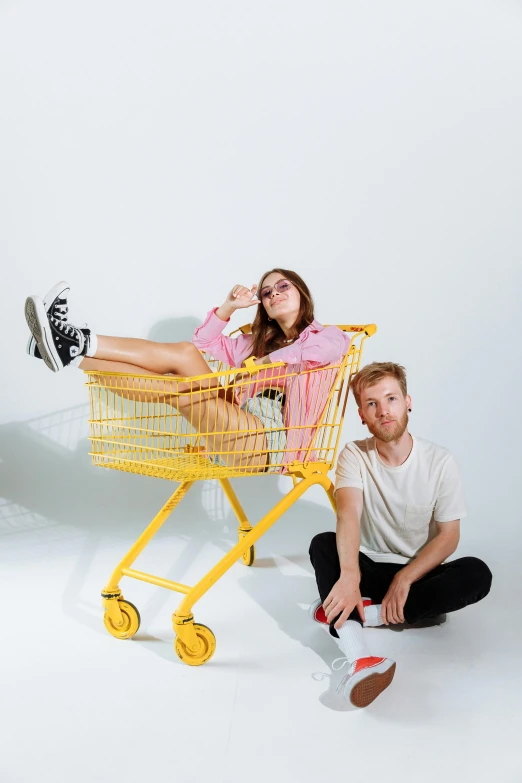 a man and a woman sitting in a shopping cart, an album cover, by Julia Pishtar, pexels contest winner, studio shoot, joel fletcher, mr beast, 15081959 21121991 01012000 4k