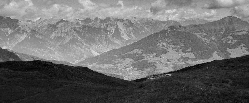 a black and white photo of a mountain range, a black and white photo, flickr, les nabis, green valley below, furio tedeschi, 2000s photo, high picture quality