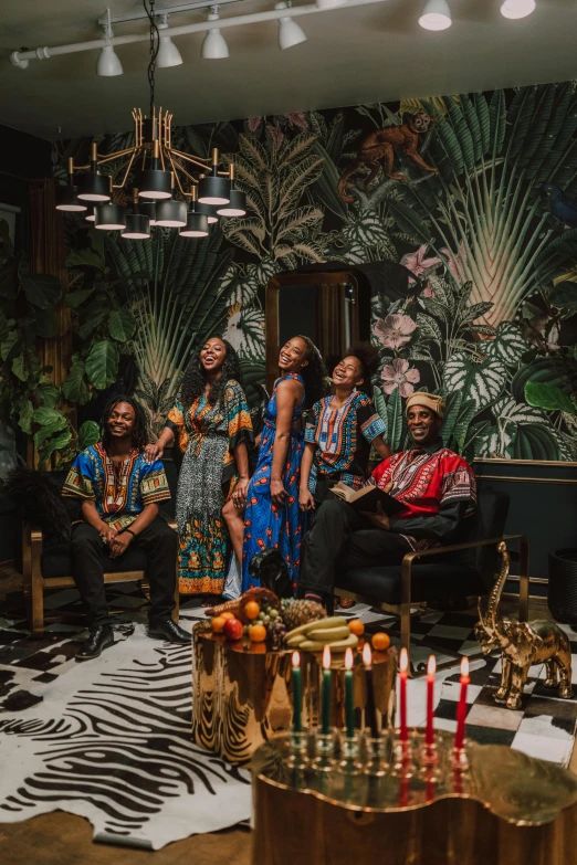 a group of people standing in a living room, black arts movement, elegant tropical prints, promo photo, africa, illuminated