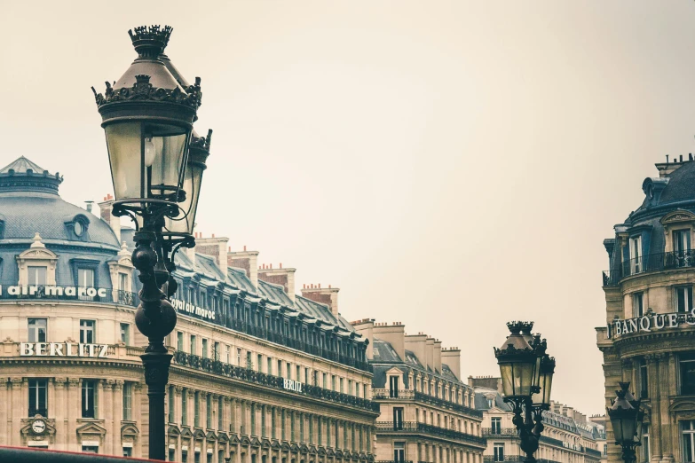 a red double decker bus driving down a street next to tall buildings, by Daniel Gelon, trending on unsplash, baroque, gas lamps, collection of louvre, under a gray foggy sky, square