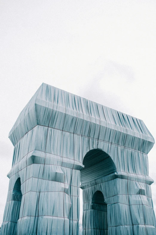 a couple of people that are standing in front of a building, a marble sculpture, inspired by Christo, trending on unsplash, conceptual art, crown made of fabric, closeup of magic water gate, white sweeping arches, view from the side